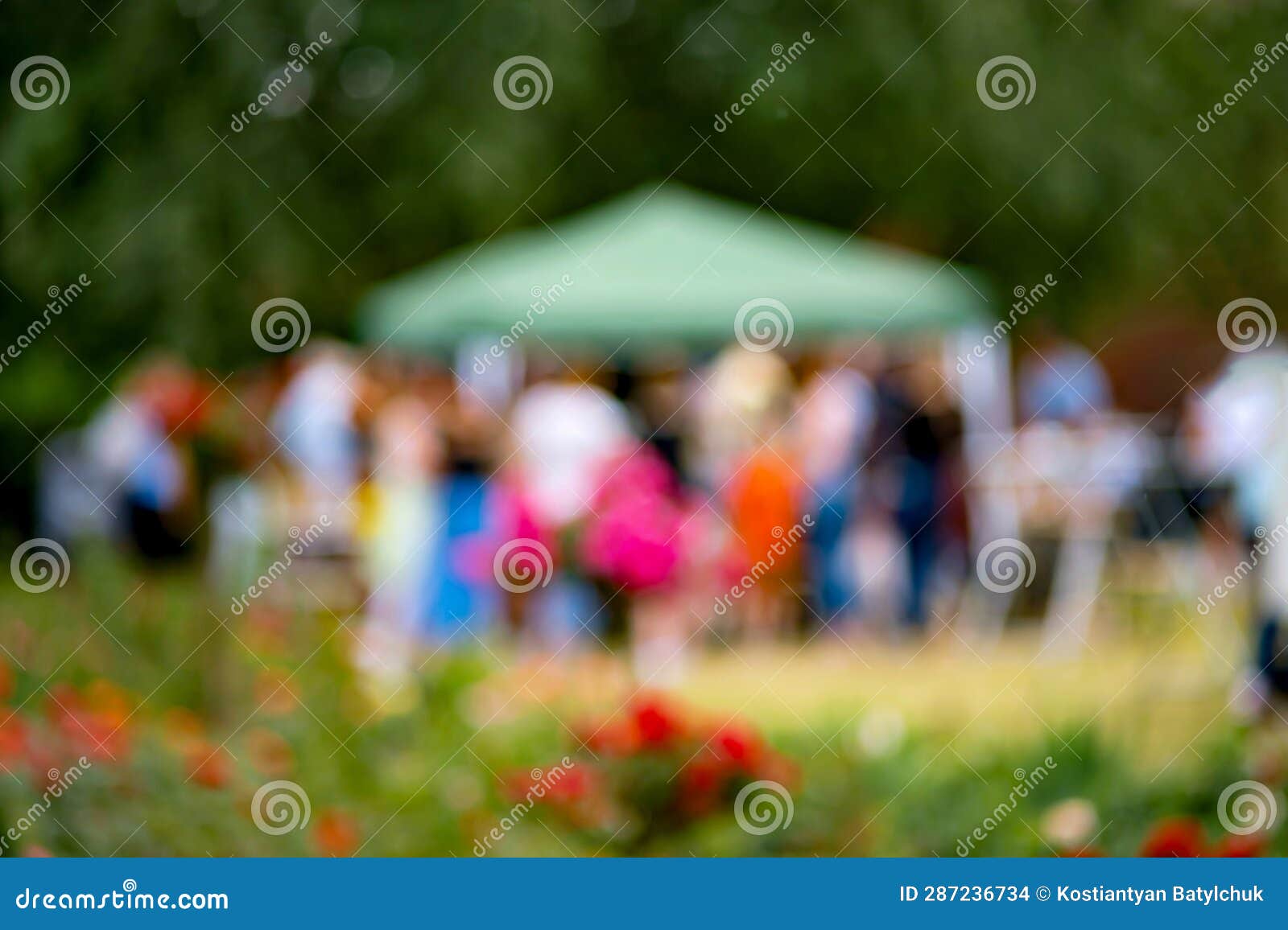 Group of People Standing Around Field of Flowers in Germany Stock Photo ...