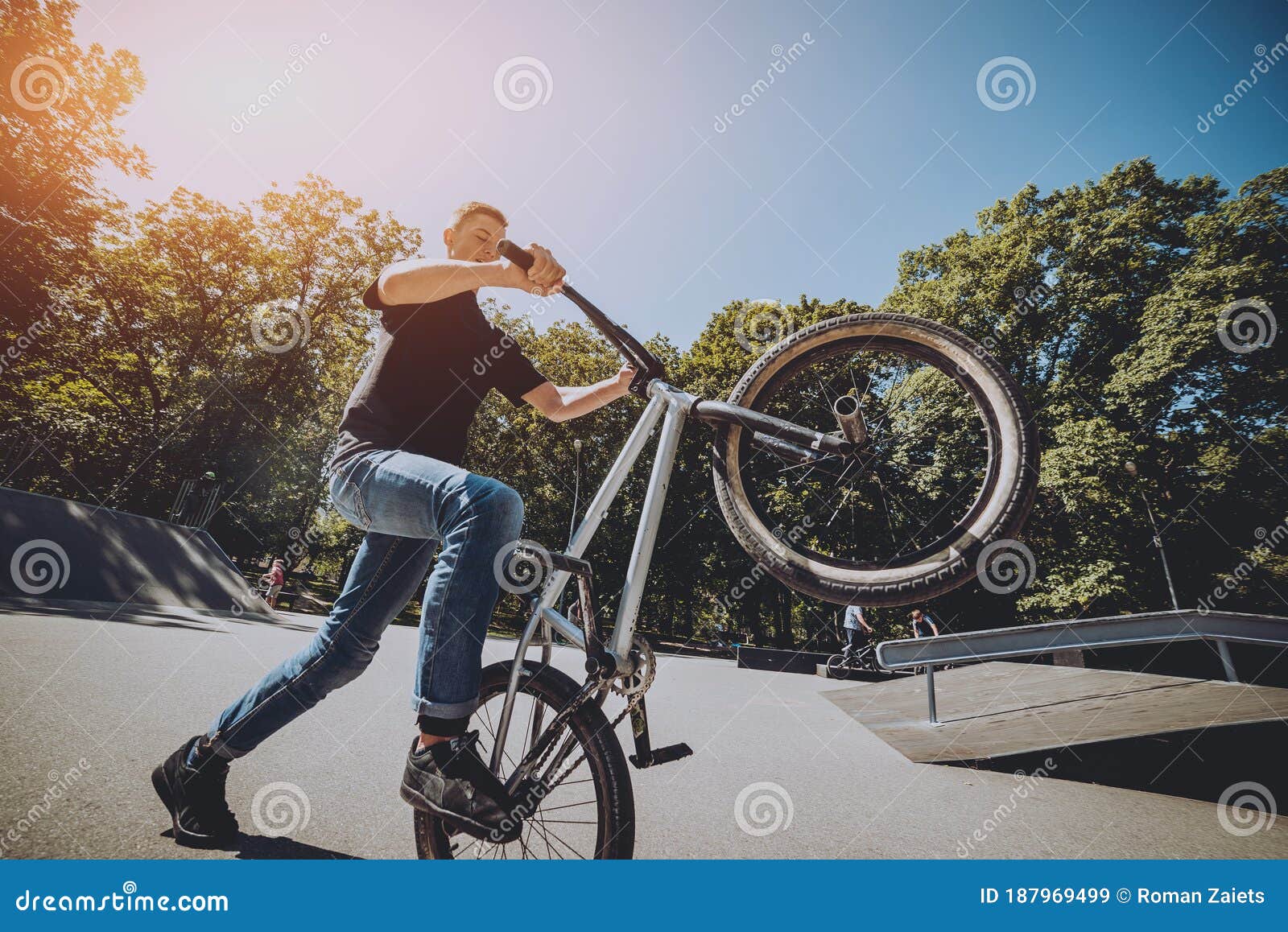 Bmx Rider Performing Tricks at Skatepark. Background. Stock Image
