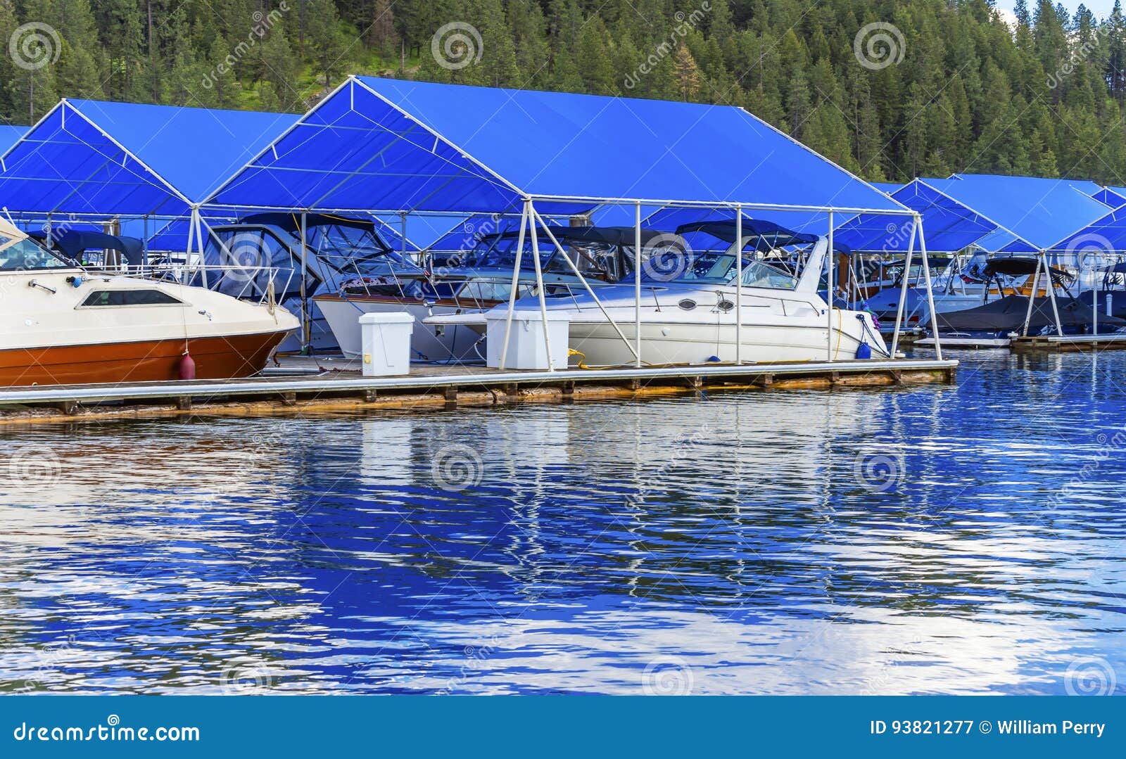 boardwalk marina piers boats reflection lake coeur d`alene idaho