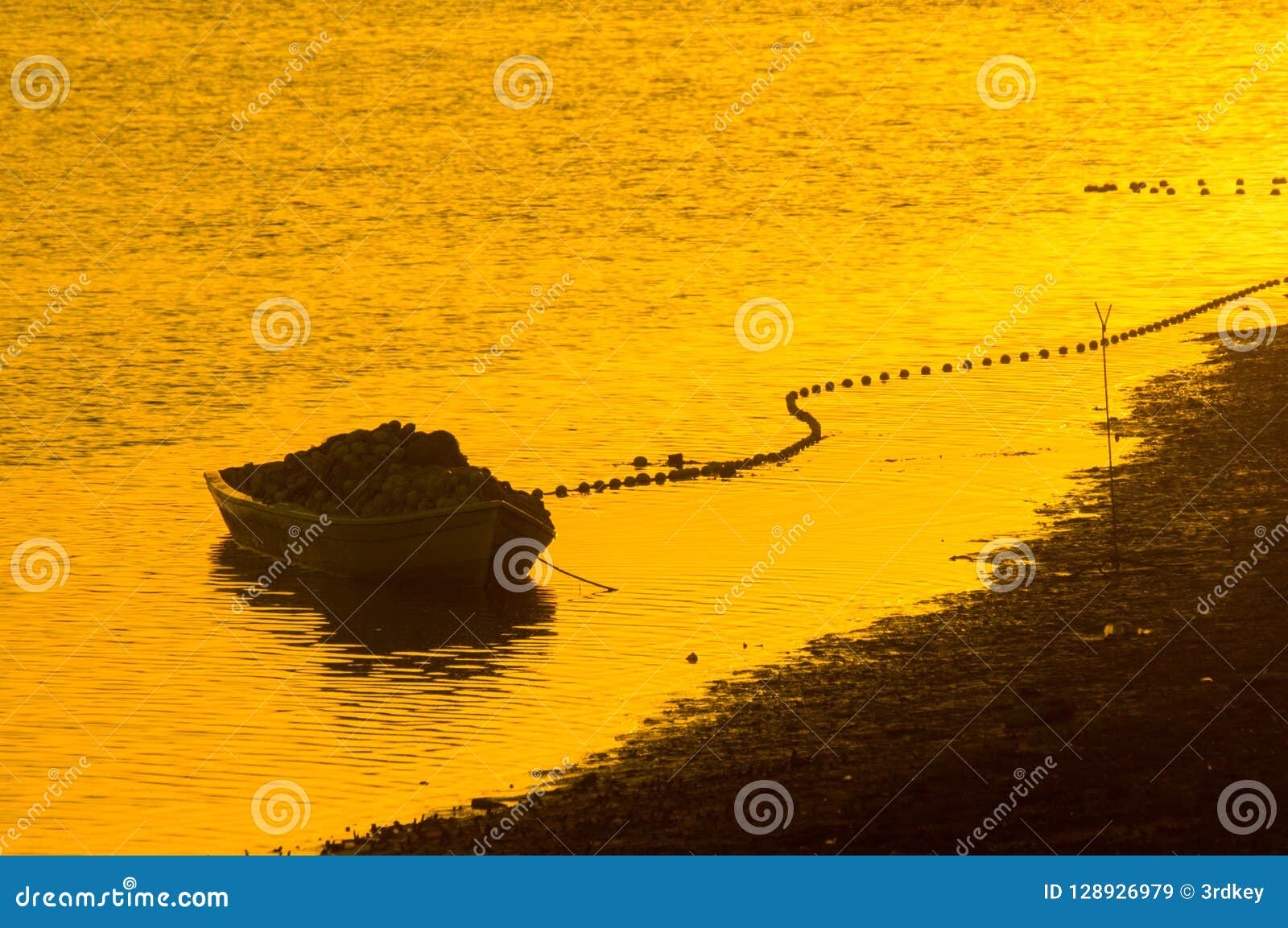 boat with fishing supply nets with noone on sunset