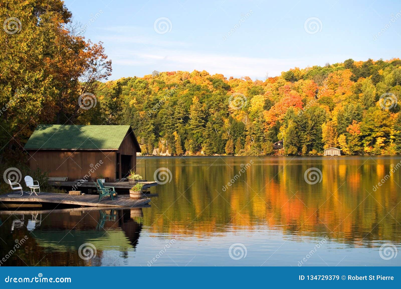 Boat House And Dock On A Beautiful Lake With Colors Of Autumn Stock