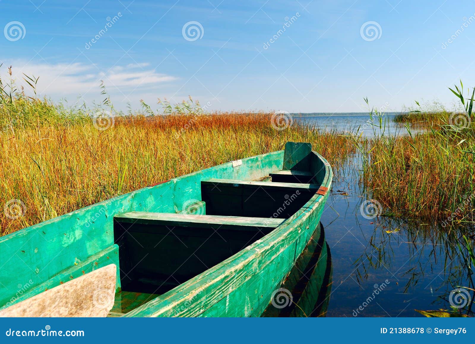 Boat on lake and cane stock photo. Image of serene, green 21388678