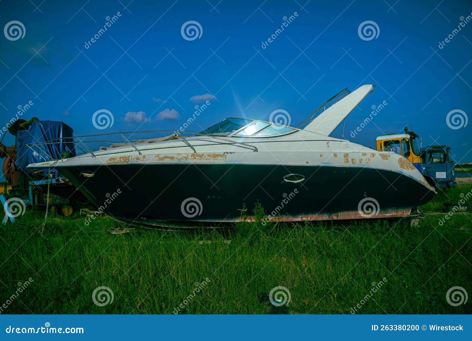 Boat parked on grassland stock photo. Image of nautical 263380200