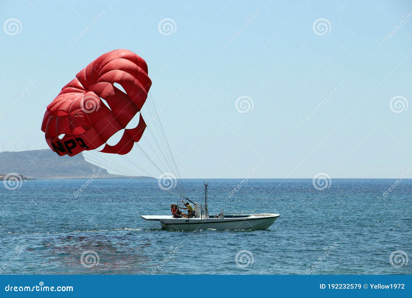 A Boat Pulls Colorful Para Sailing at the Blue Sea Editorial Stock