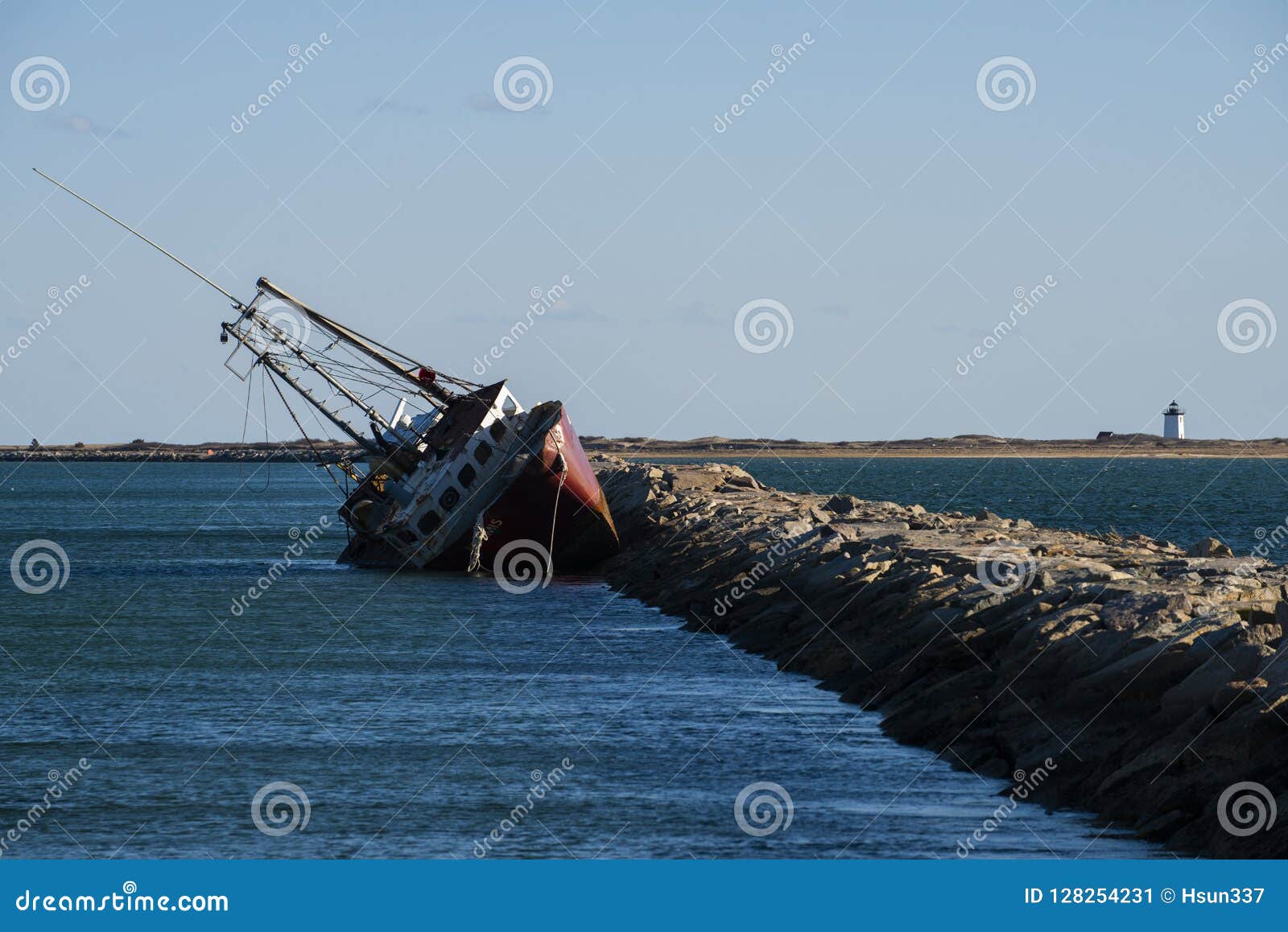 Boat Sinks at Rock Seawall editorial photo. Image of ruined - 128254231