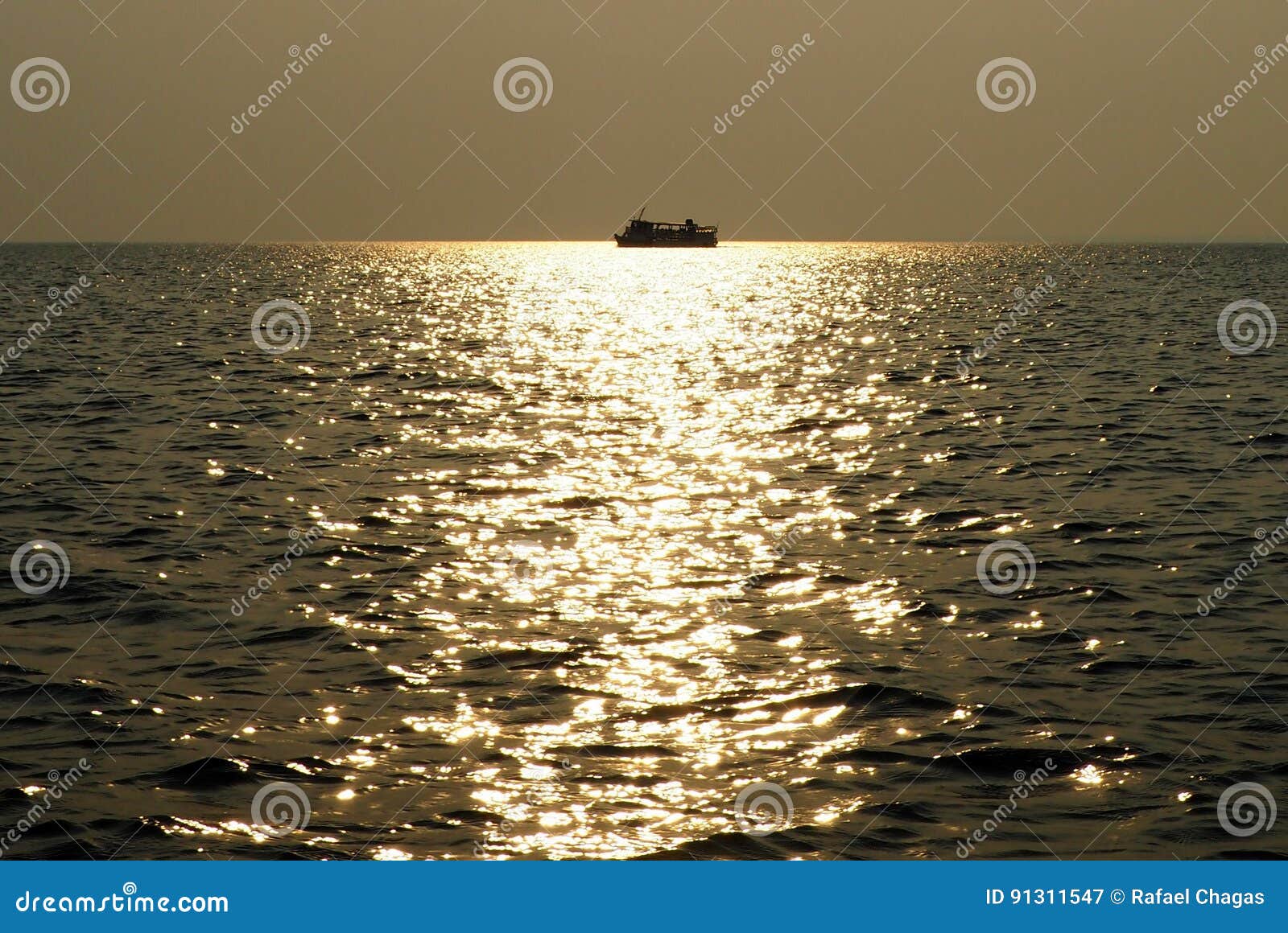 boat at sunset in tapajos river - amazon / brazil