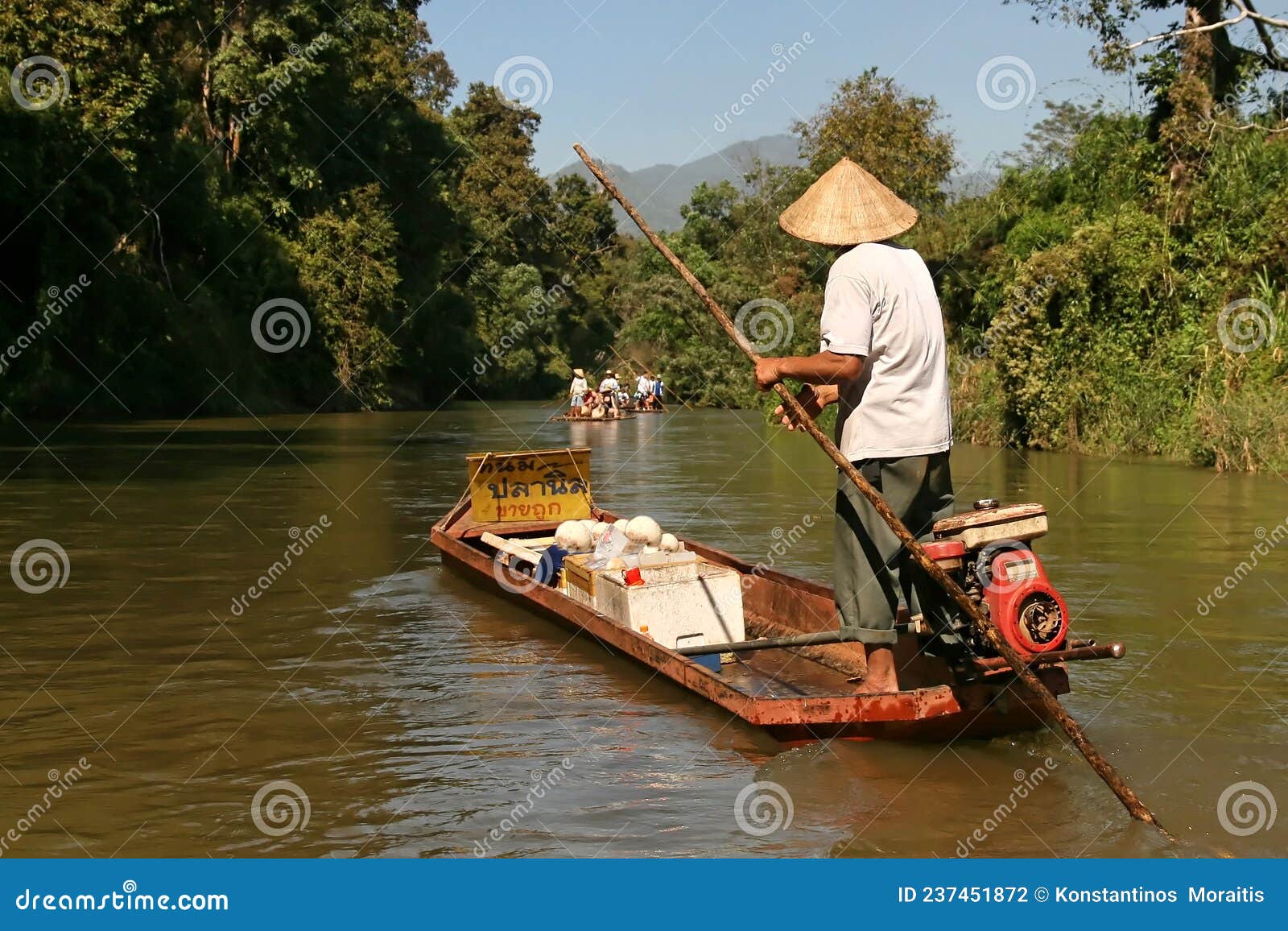 boatman sell`s food in the river