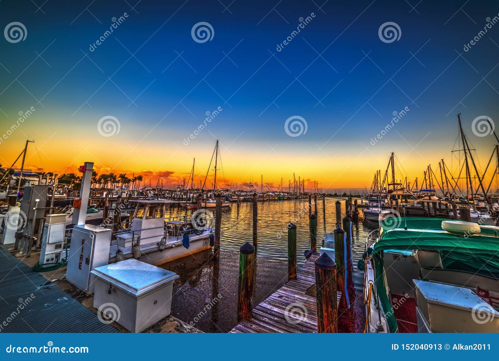boats in coconut grove harbor at sunset