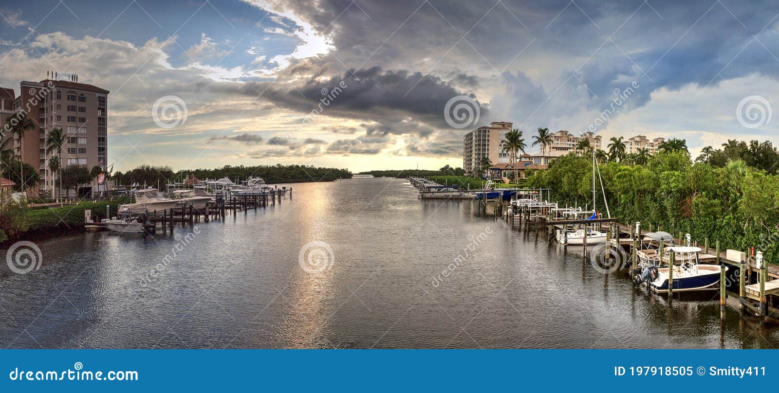 boats docked in a harbor along the cocohatchee river in bonita springs