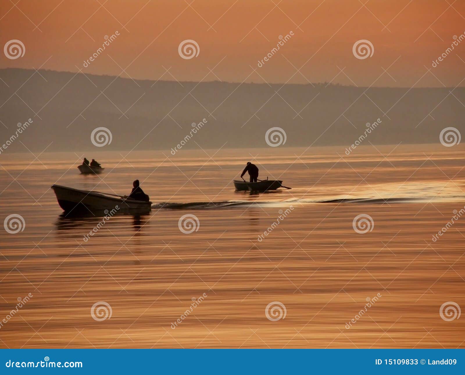 boats in haze and sunset