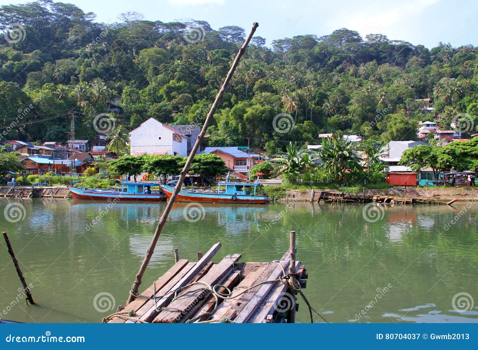 boats on the batang arau river in padang, west sumatra