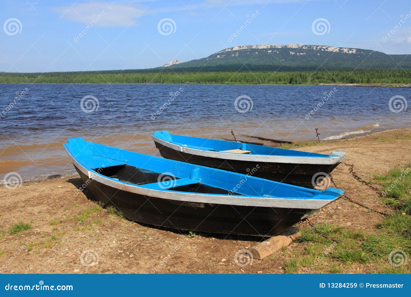 Boats near lake stock image. Image of grass, blue, horizon - 13284259