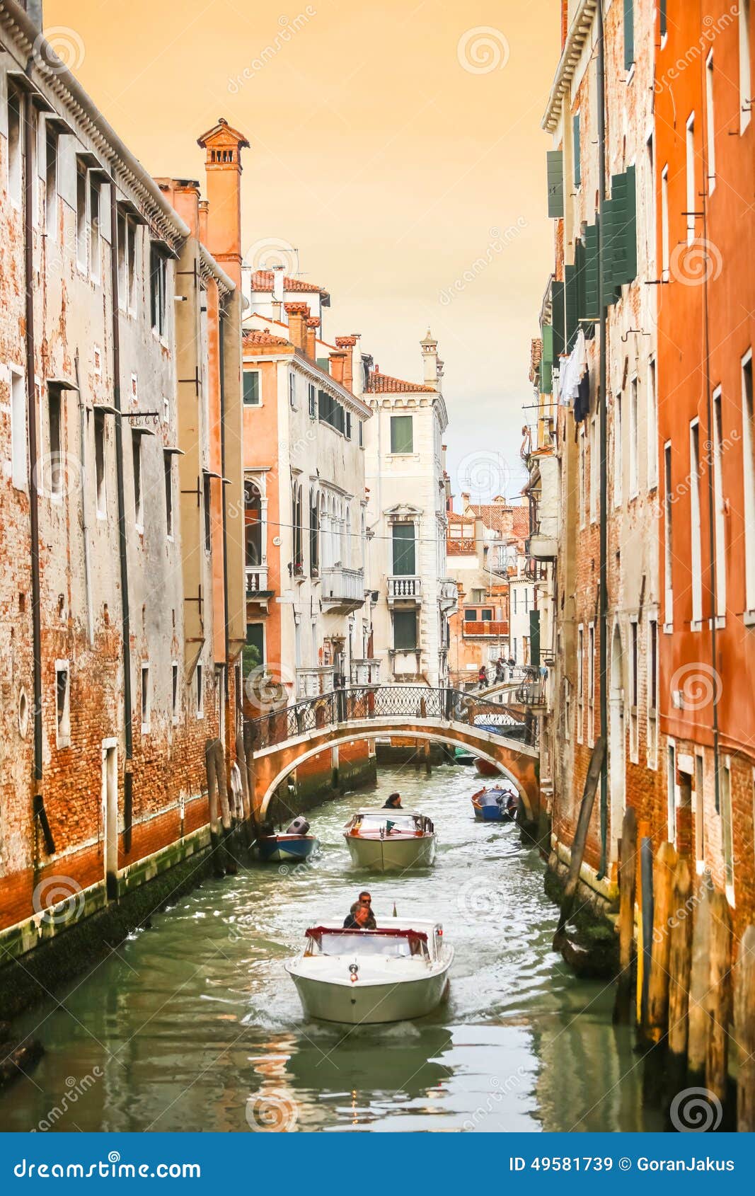 Boats Sailing in Water Canal with Orange Buildings Editorial Stock ...