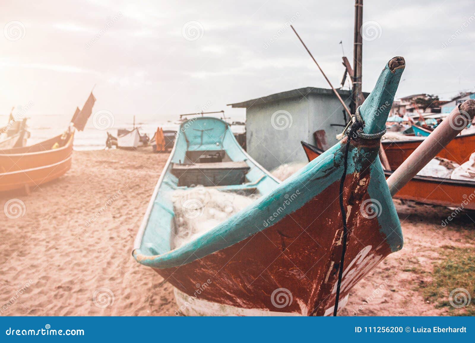 boats by the sea on a sunny day.