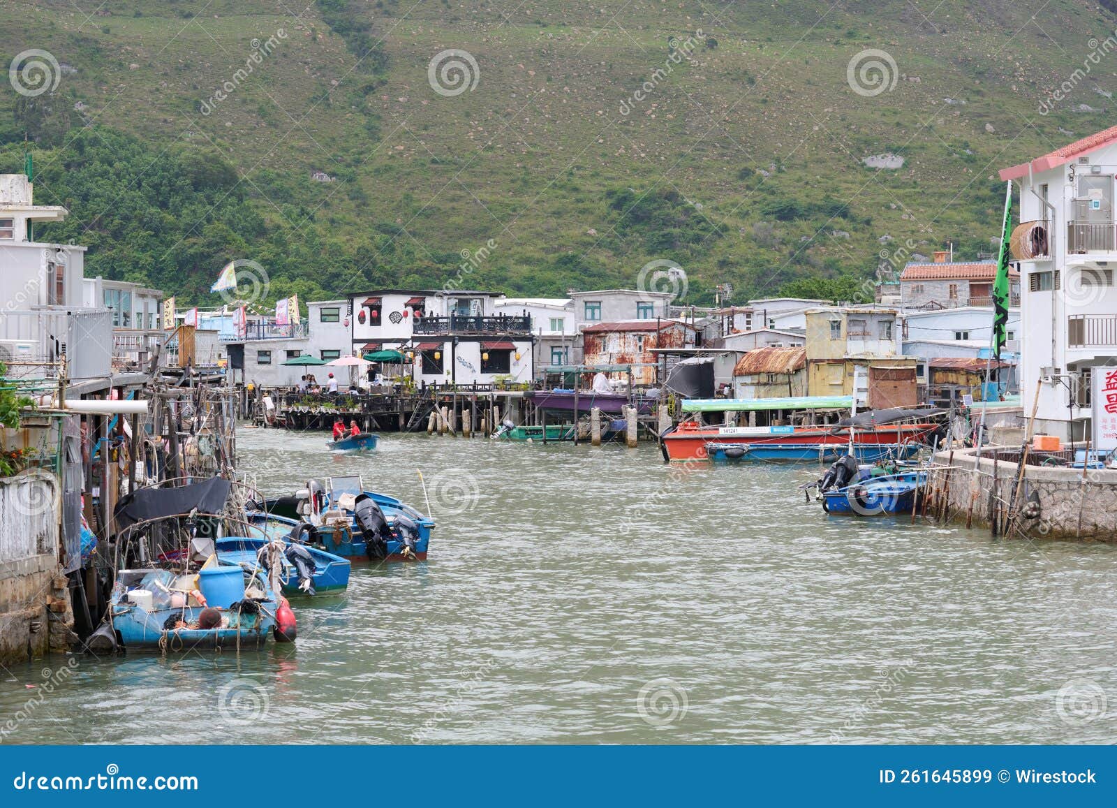 Boats on a Small River with Small Old Houses Around it in Tai O Island