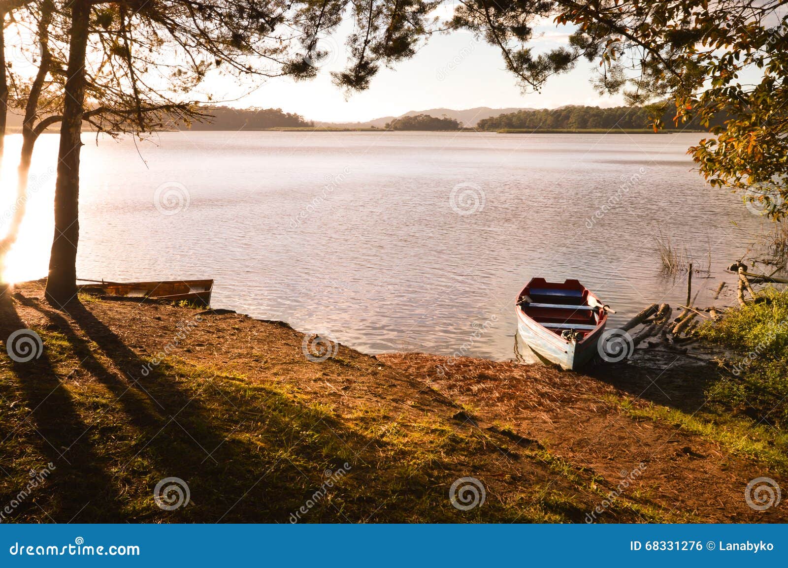 boats at sunset in the lagunas de montebello national park chiapas, mexico