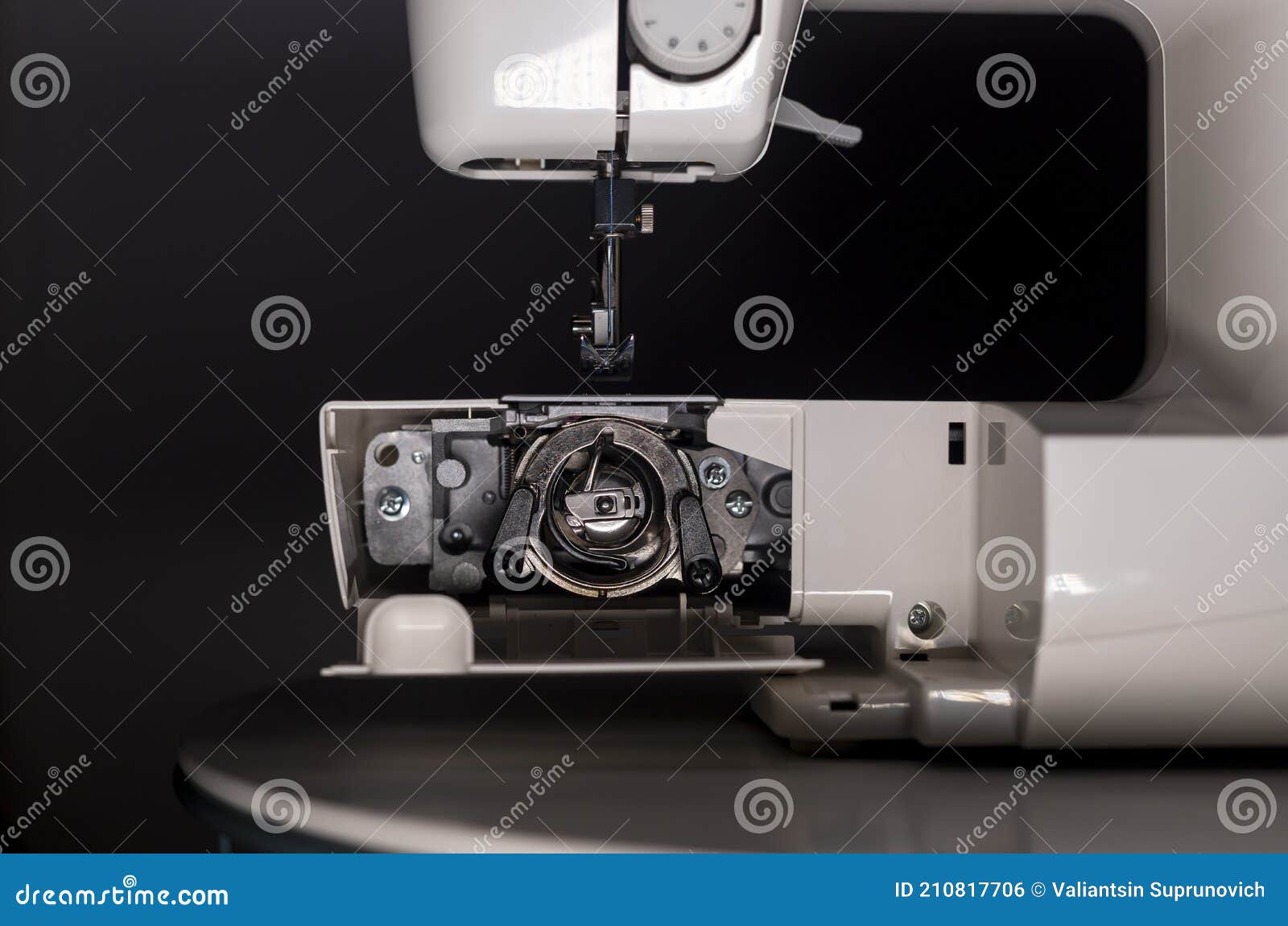 Bobbin and Other Metal Parts in Electric Sewing Machine Stock Photo