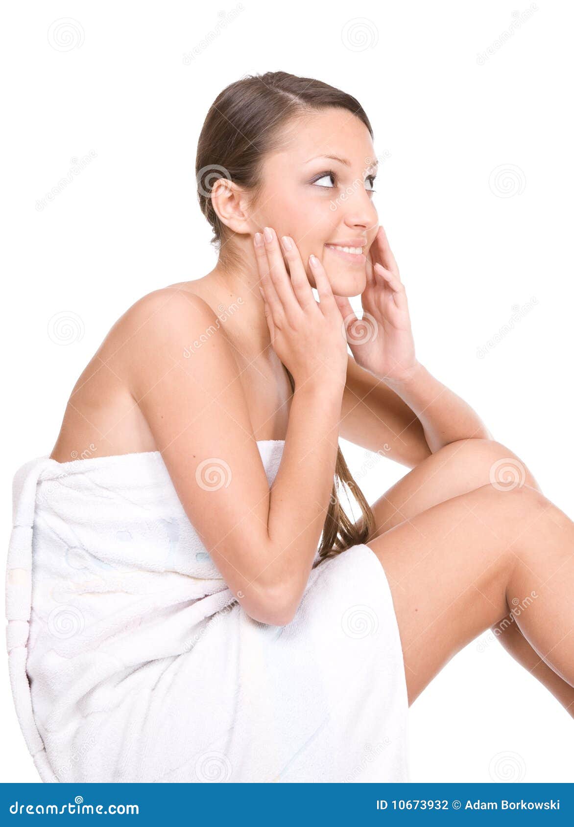 Body care. Happy young fresh woman in towel