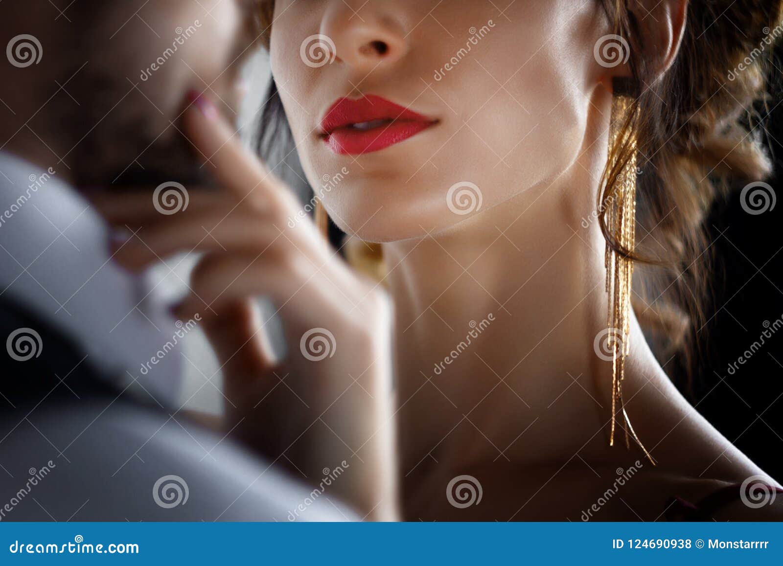 Rich Man Tempts Woman in Red Evening Dress Stock Photo picture image pic