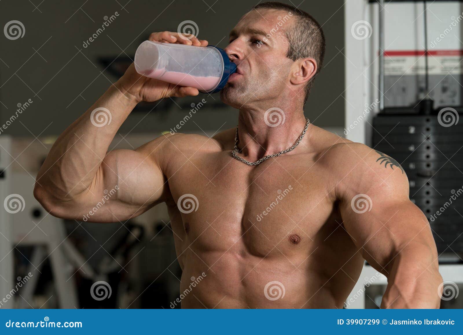 Bodybuilder Drinking from a Bottle of Water Stock Image Image of