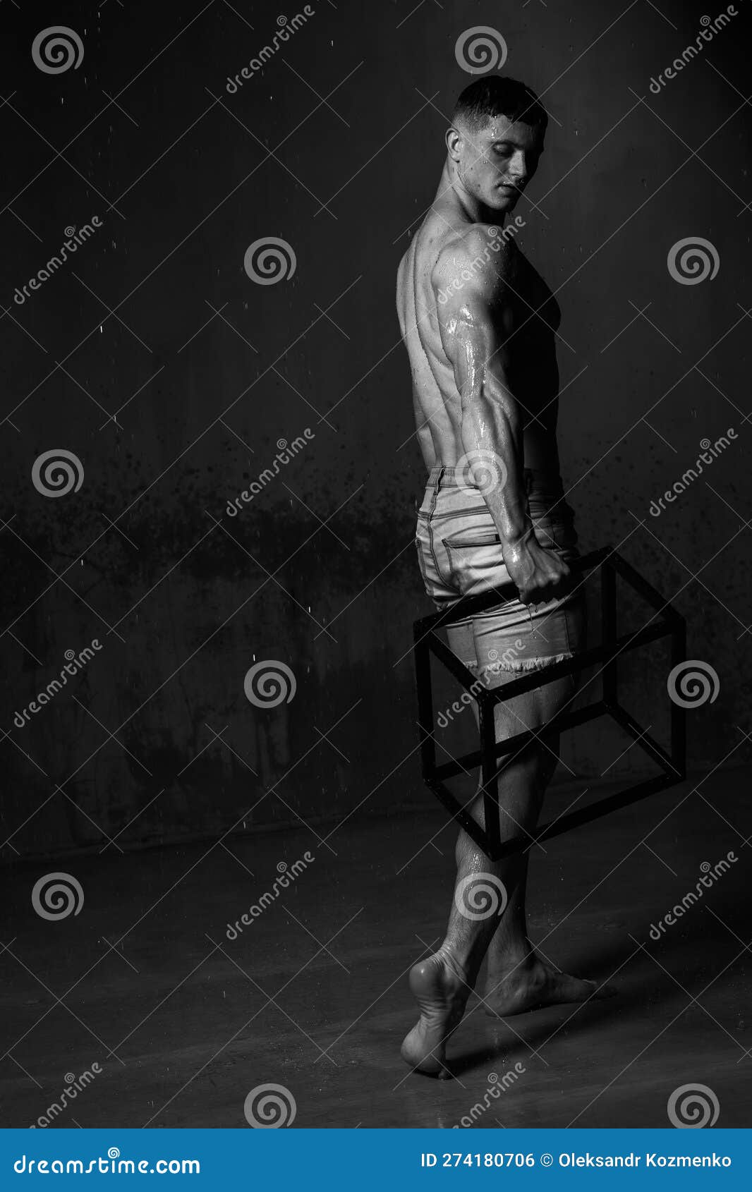 Athlete Bodybuilder Trains in the Studio in the Rain. Stock Photo ...