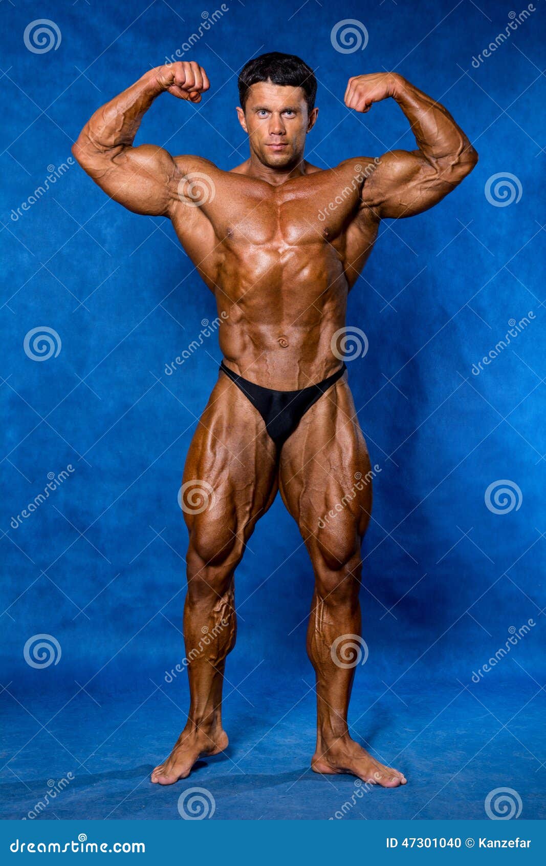 Bodybuilder Flexing His Muscles in Studio Stock Photo Image of