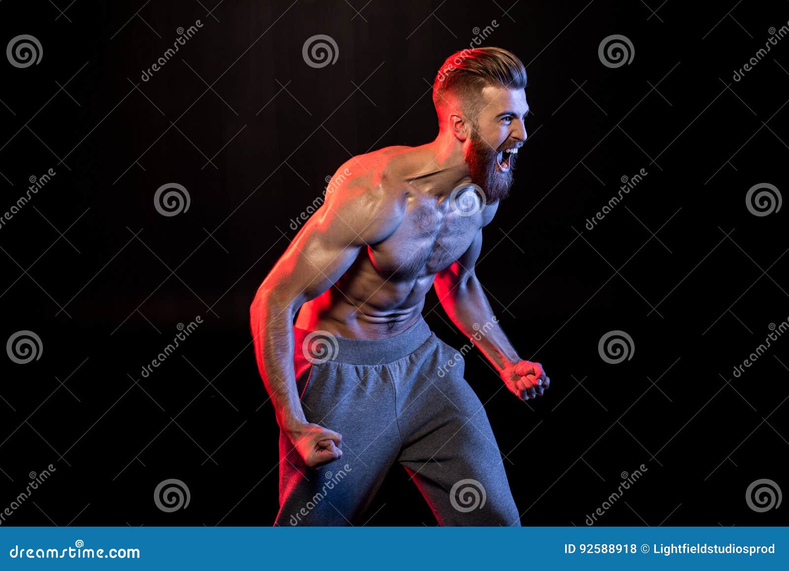 Bodybuilder Gesturing and Yelling Isolated on Black with Dramatic