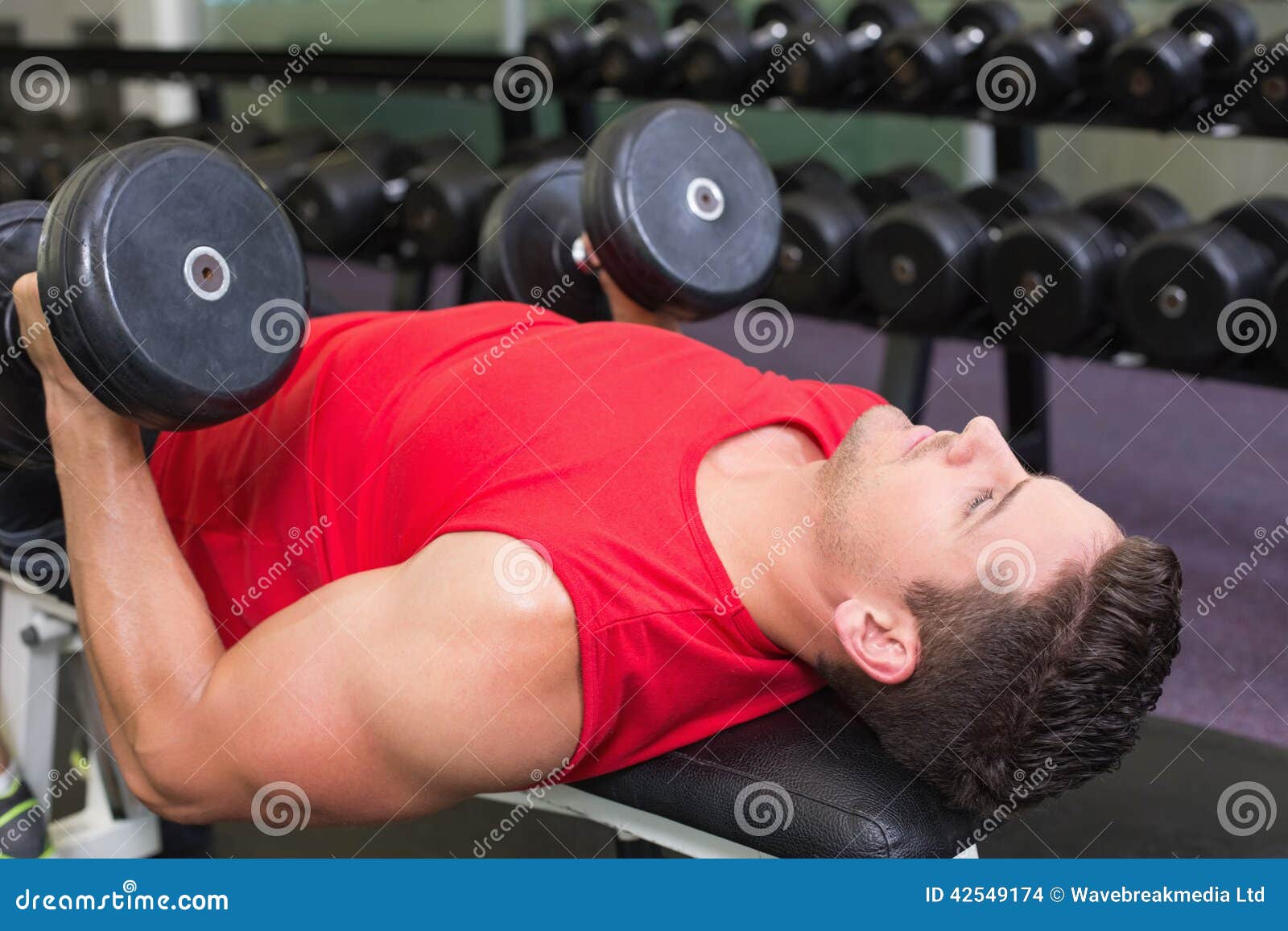 Bodybuilder Lying On The Floor In The Studio Stock Photo