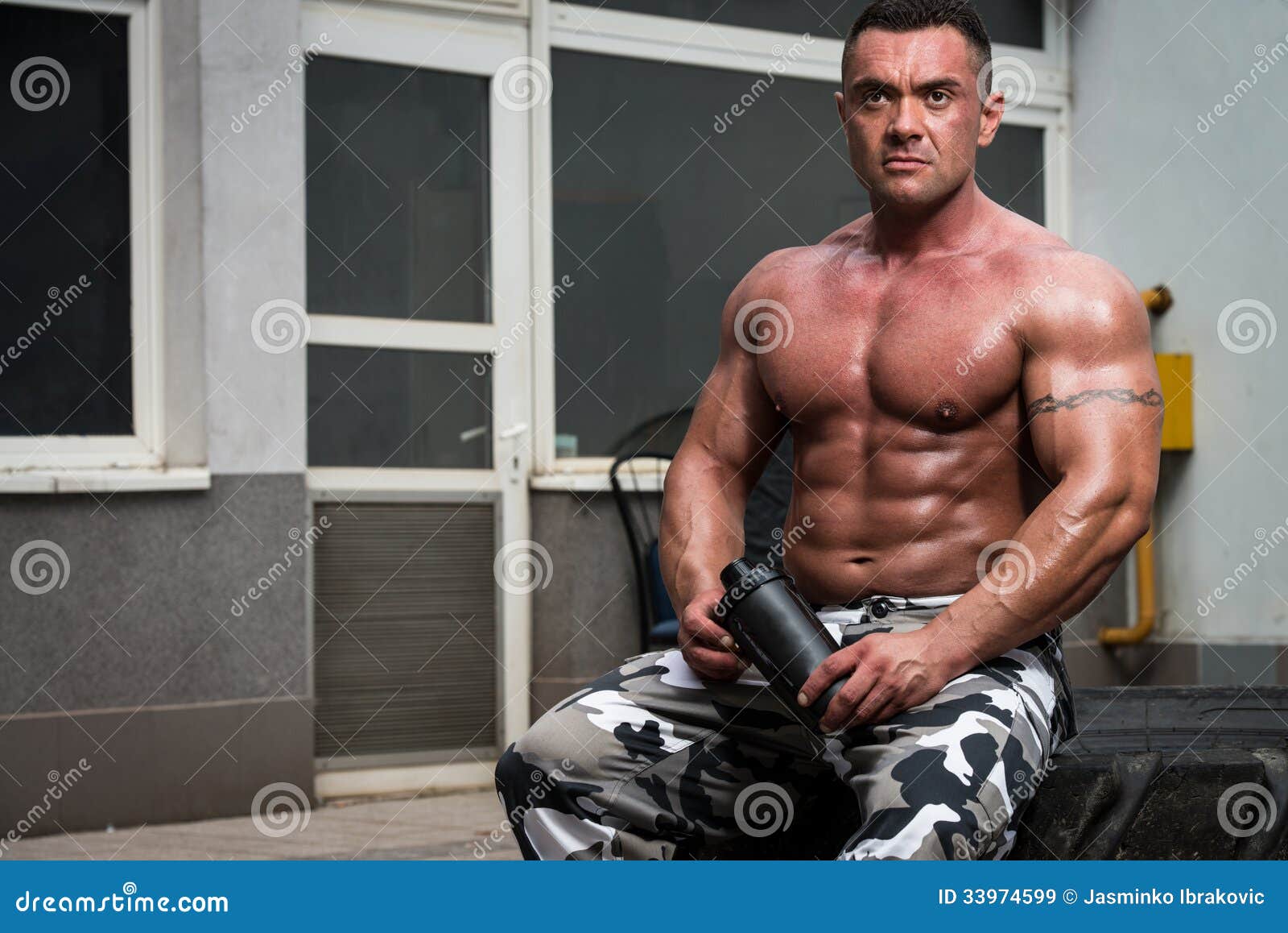 https://thumbs.dreamstime.com/z/bodybuilder-resting-drinking-protein-shake-exercising-gym-muscular-man-truck-tire-doing-crossfit-style-workout-33974599.jpg