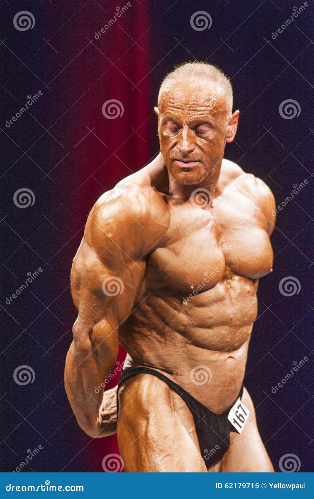 Bodybuilder Shows Triceps Pose on Stage in Championship Editorial Image -  Image of fitness, championship: 62179715