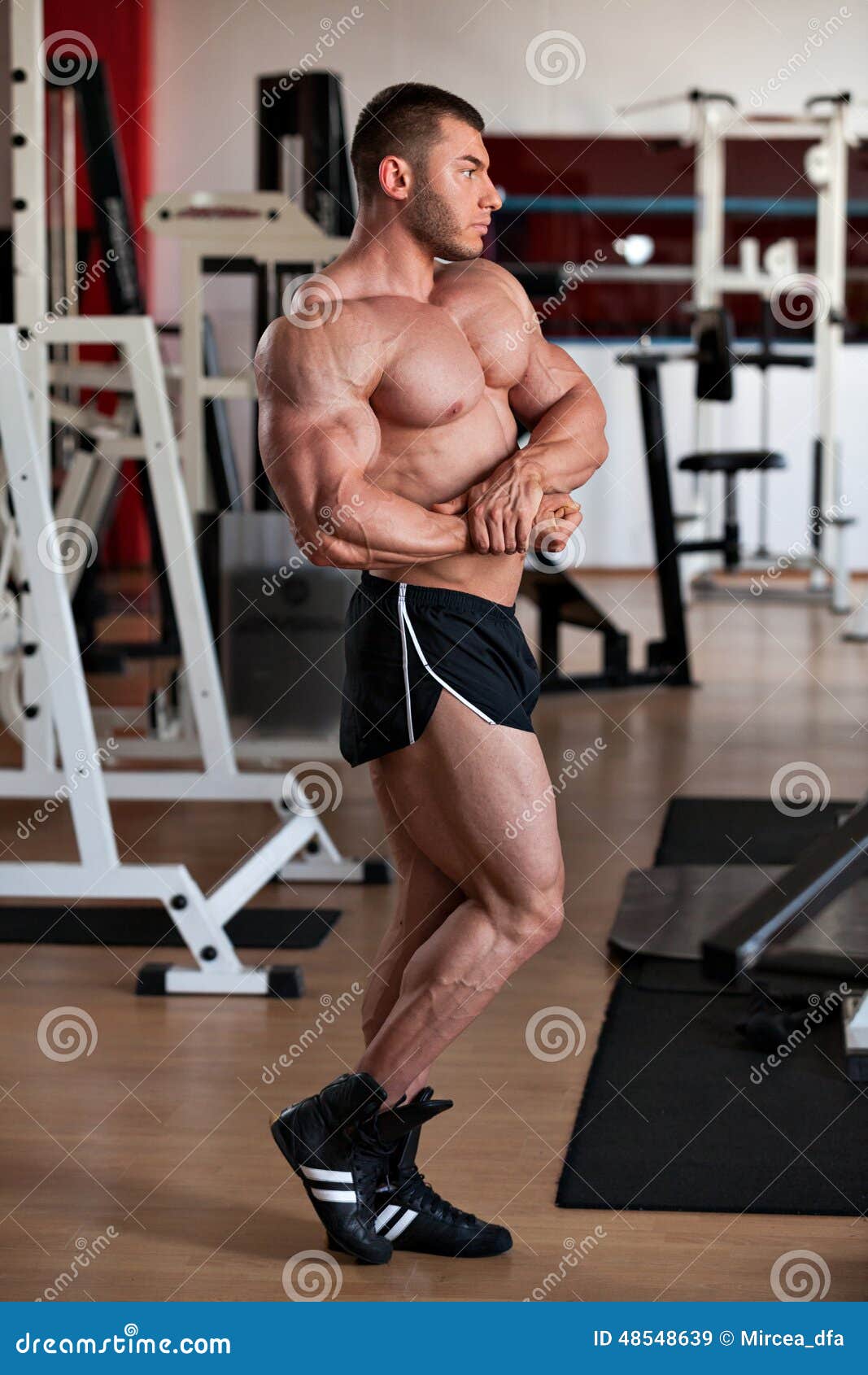 Bodybuilder side chest stock image. Image of shredded 48548639