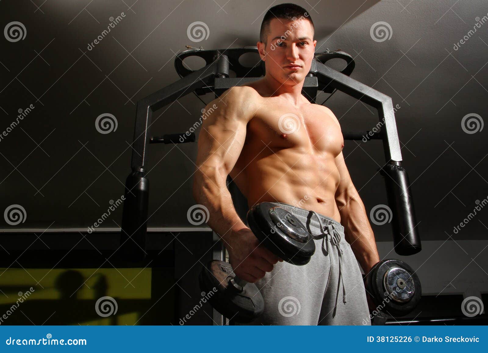 Bodybuilder training hard stock photo. Image of muscular 38125226