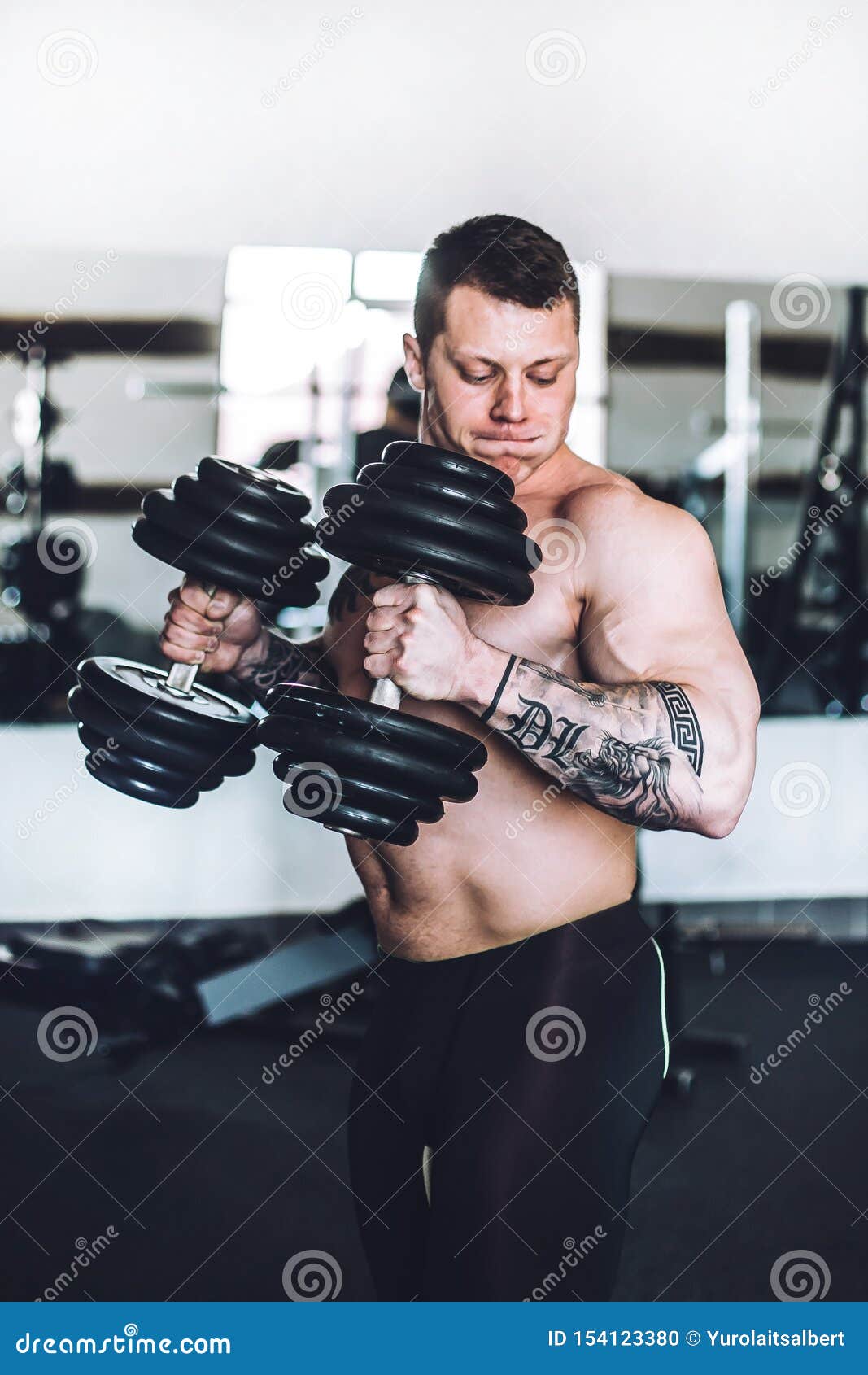 Bodybuilding Coach on Strength Training in the Fitness Room Stock Photo
