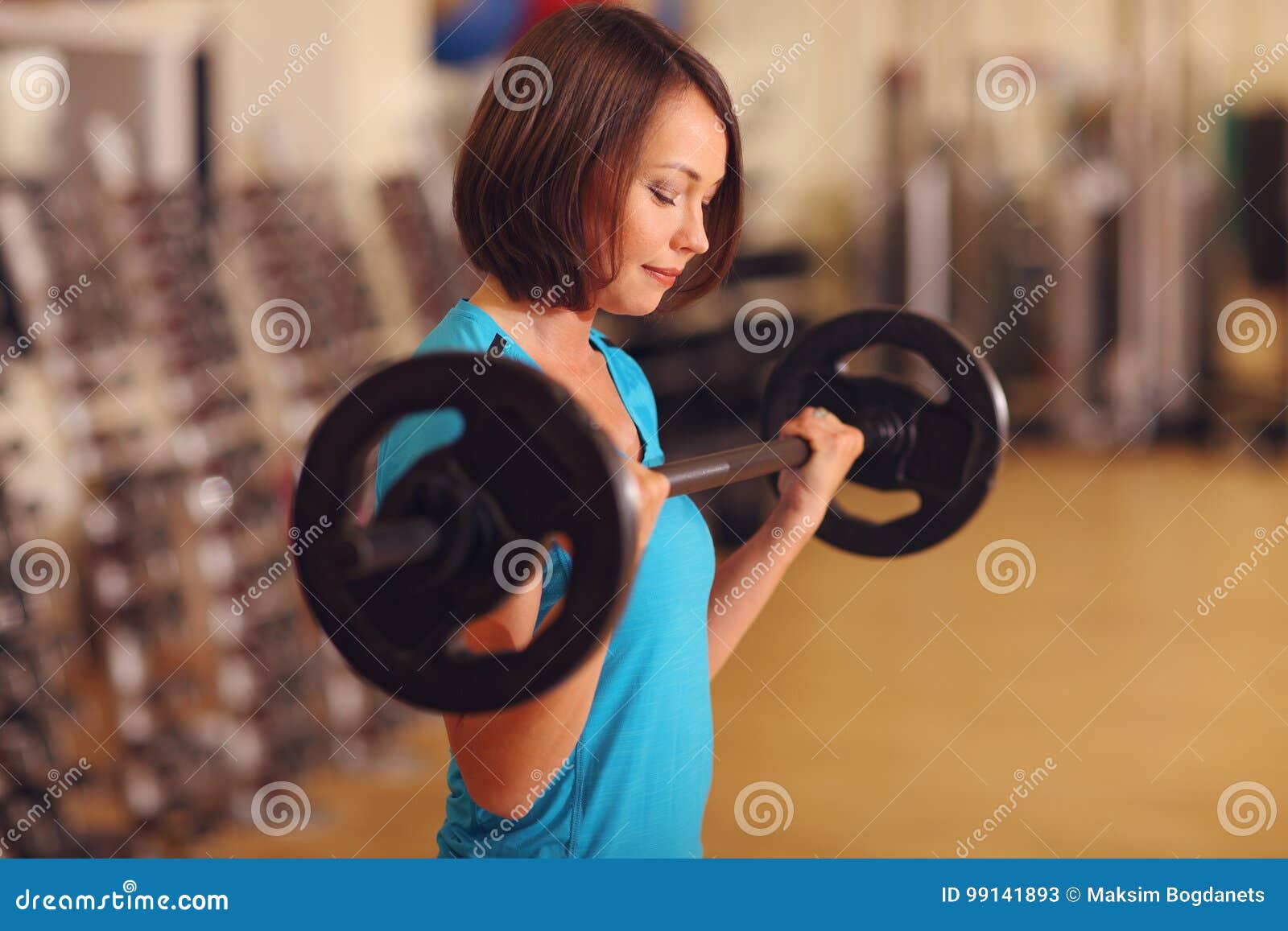 Bodybuilding. Woman Exercising With Barbell In Fitness Class. Female