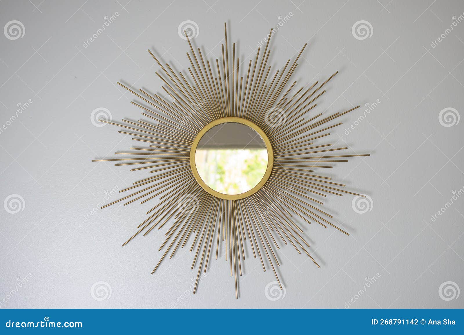 Boho Mirror Sun Shape. Sunshaped Mirror in Interior Stock Photo