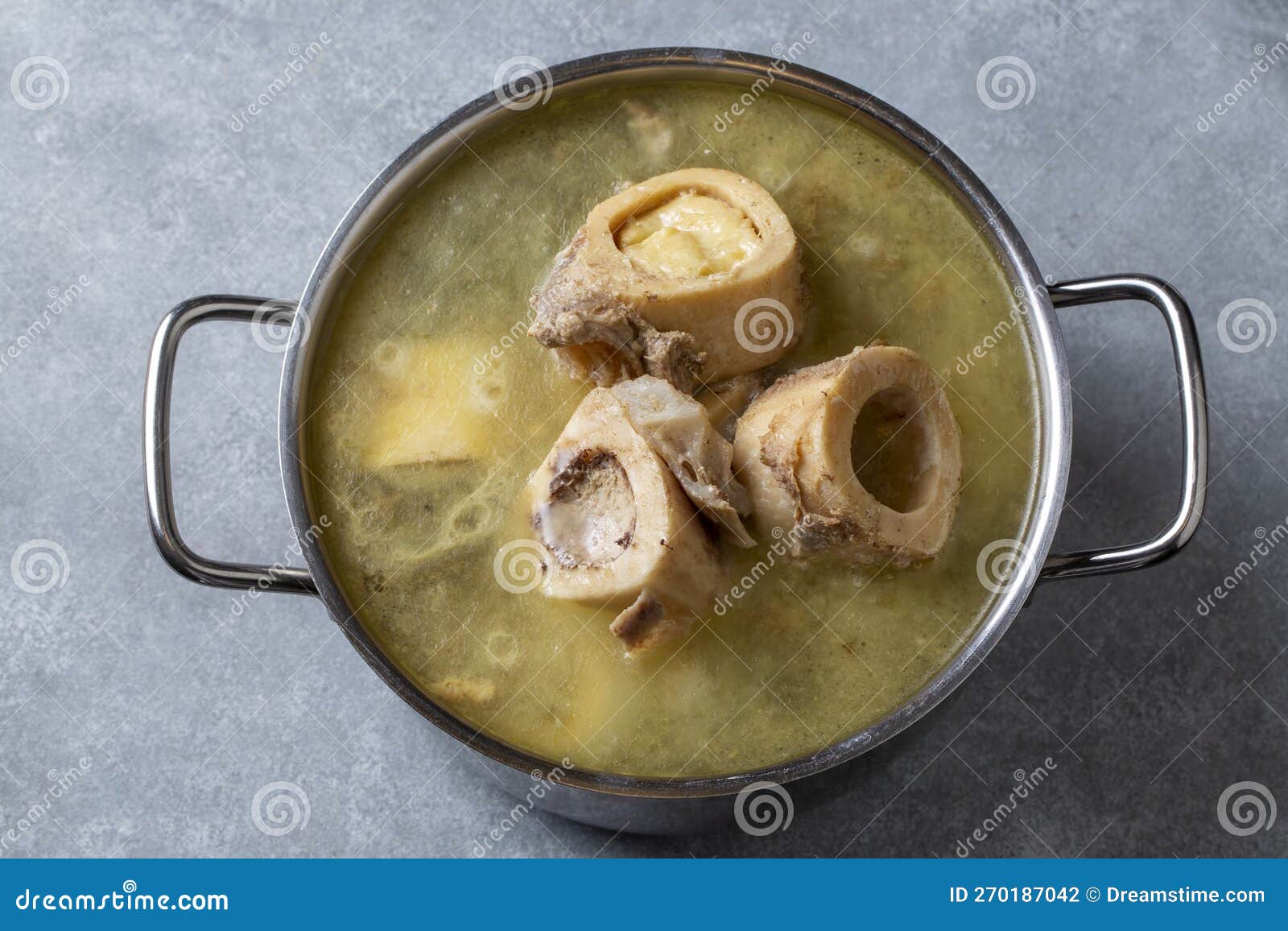 Boiled Bone and Broth. Homemade Beef Bone Broth is Cooked in a Pot on