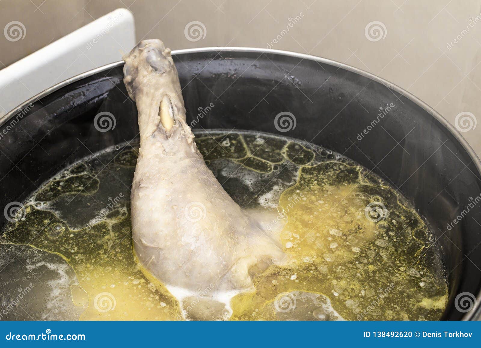 Boiled Chicken in a Pot Broth Close-up with Blurred Background and
