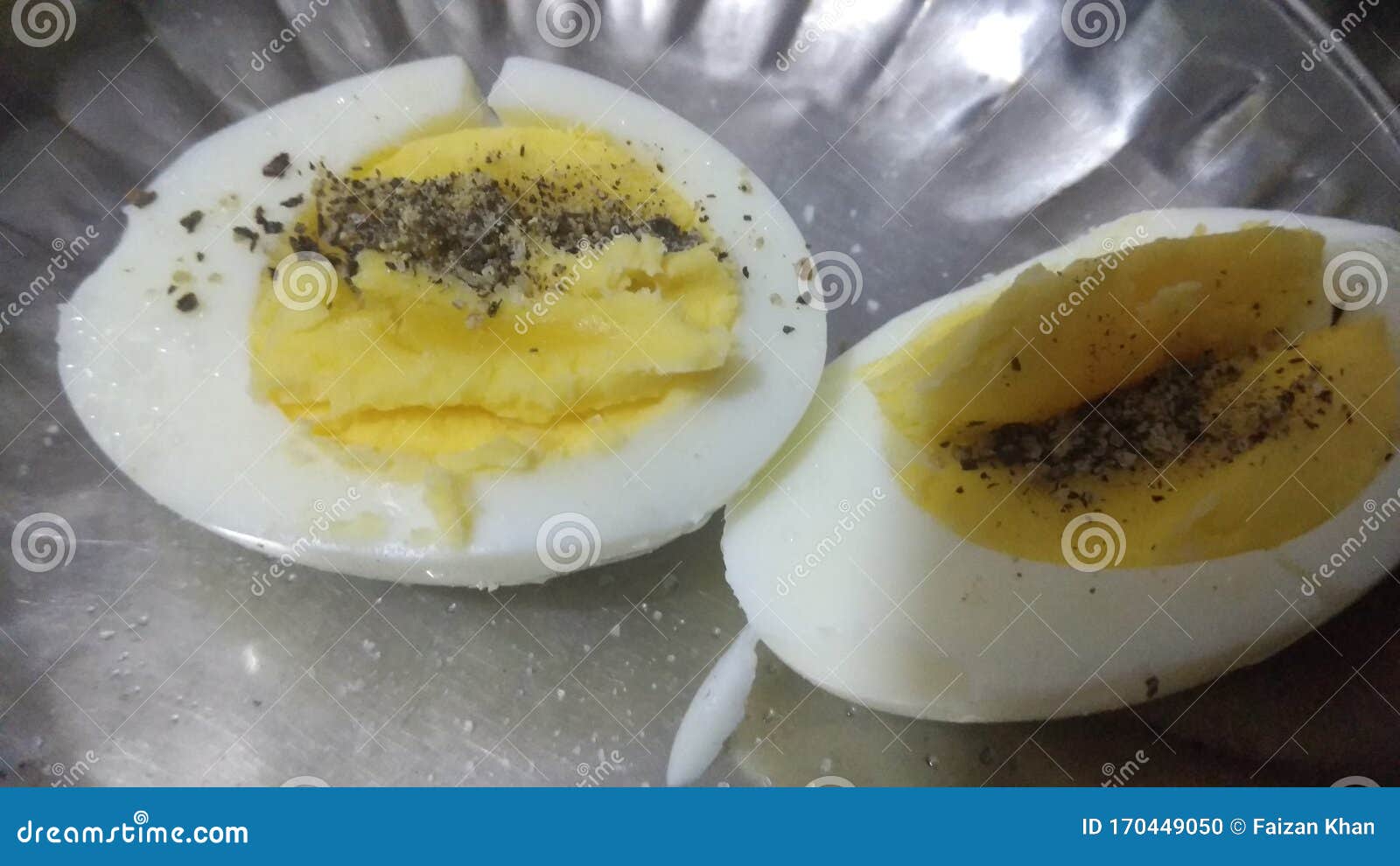 Boiled Egg Seasoned with Black Pepper Powder and Table Salt Stock Photo