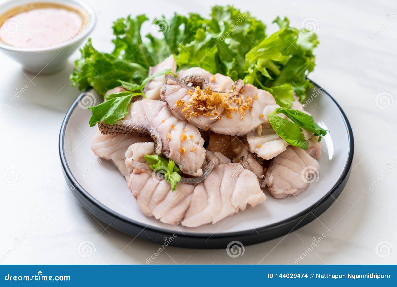 Boiled fish dip with sauce stock photo. Image of white 144029474