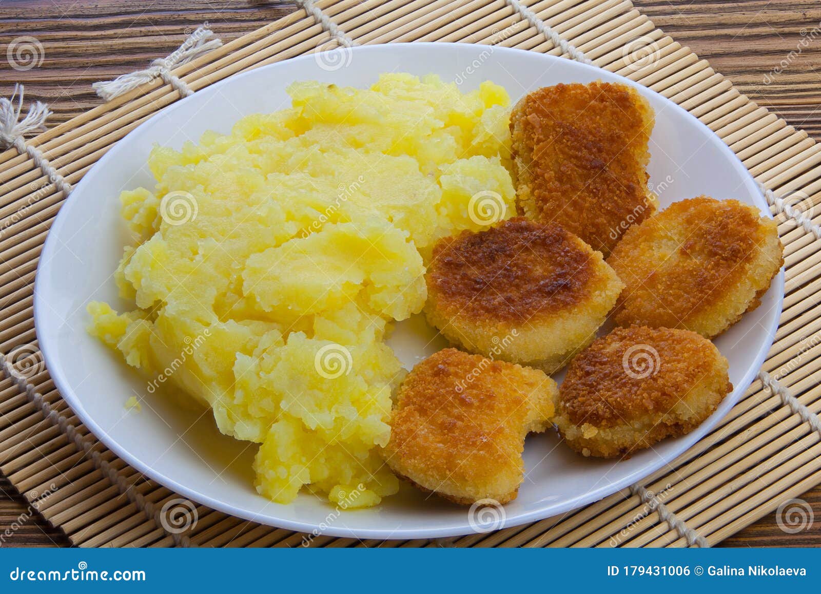 Boiled Mashed Potatoes on a Plate with Chicken Nuggets on Table Stock Photo Image of wood