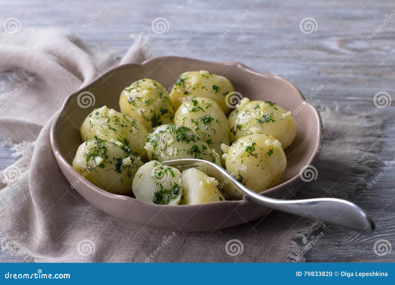 Boiled Potatoes With Herb Butter And Garlic Stock Photo ...