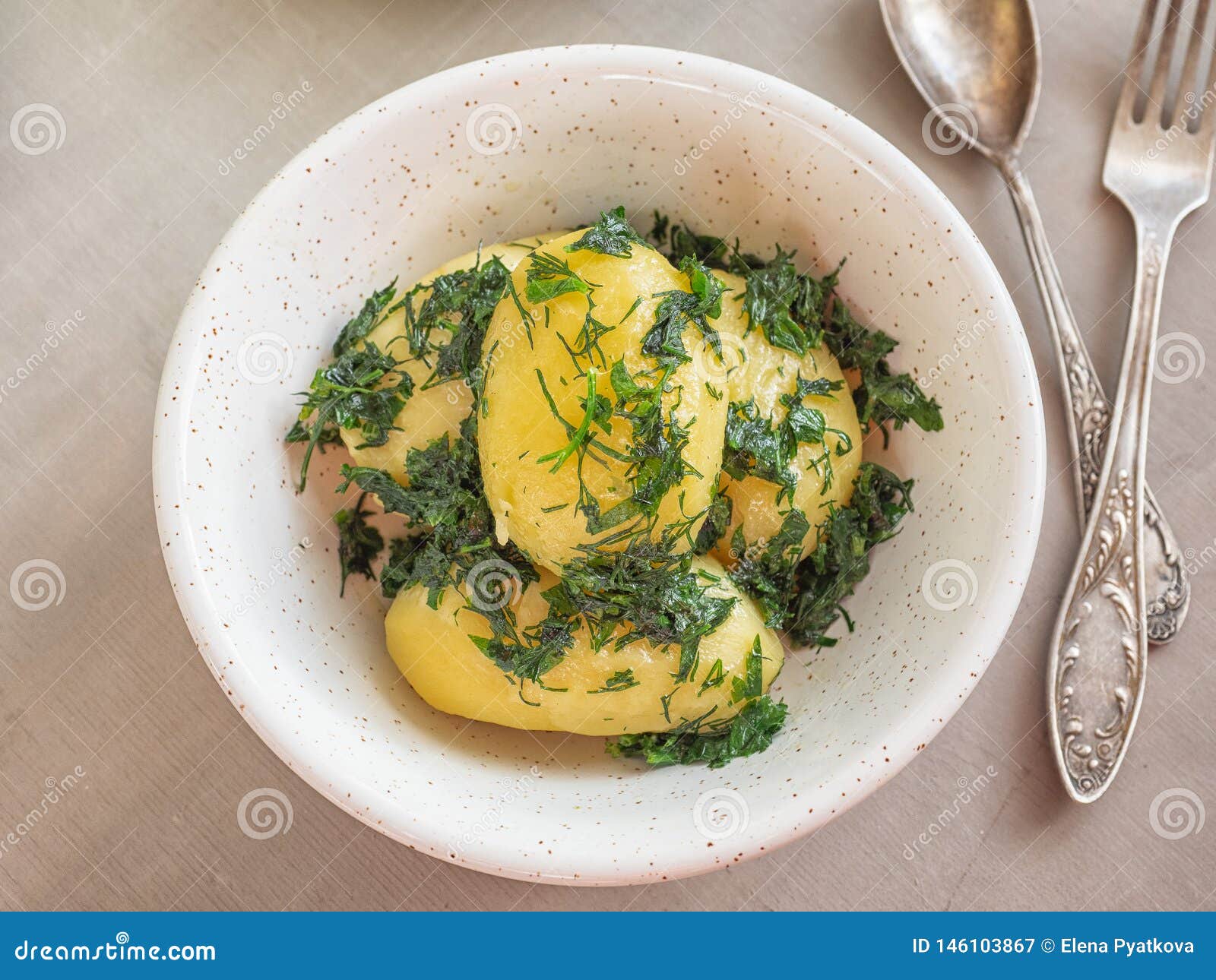 Boiled Potatoes with Herbs in a Deep Plate Shot at Close Range Stock