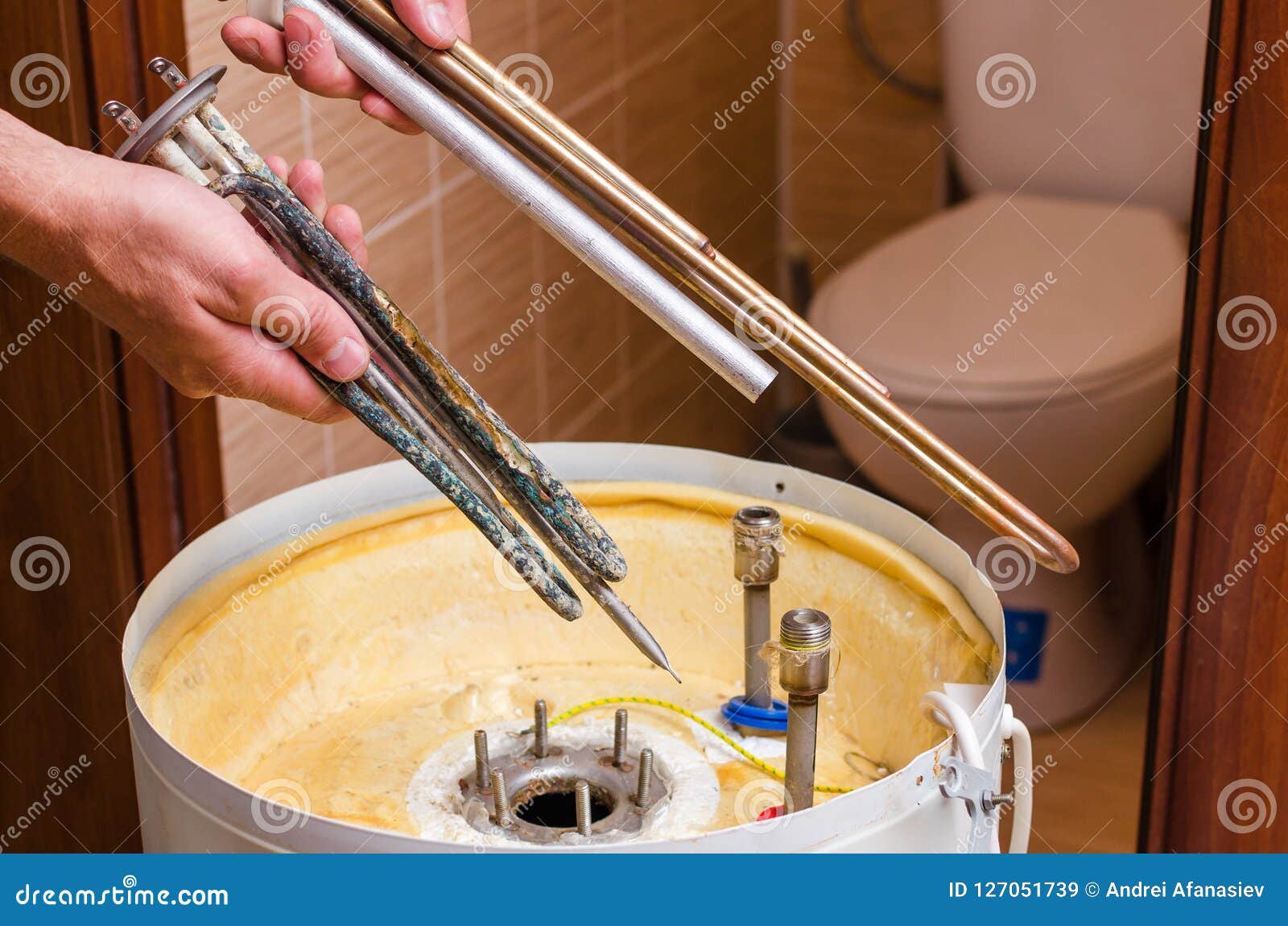 Boiler Repair, Replacement of Broken Water Heating Element Stock Image