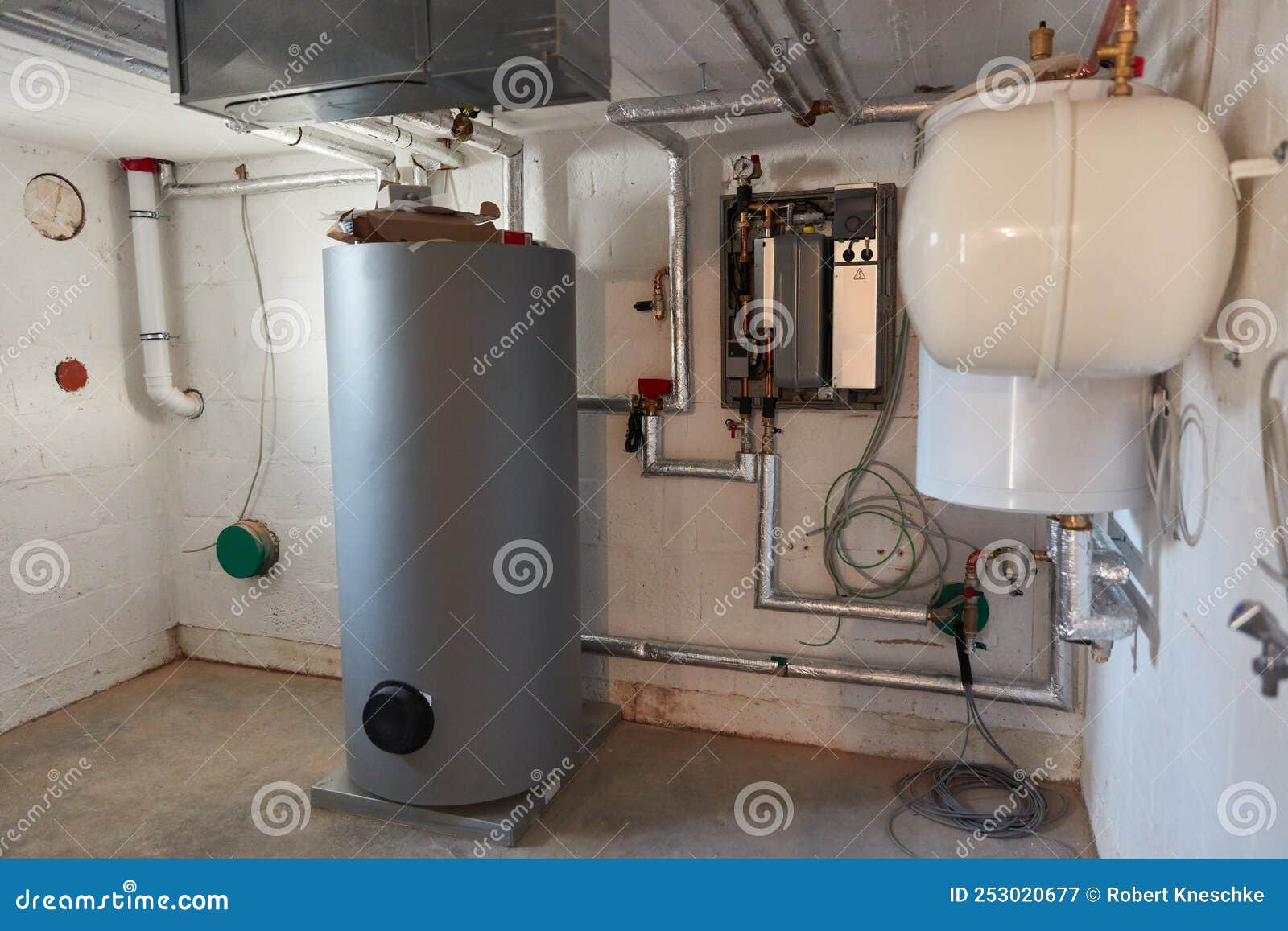 Boiler Room in the Basement with Boiler and Heat Pump Stock Image