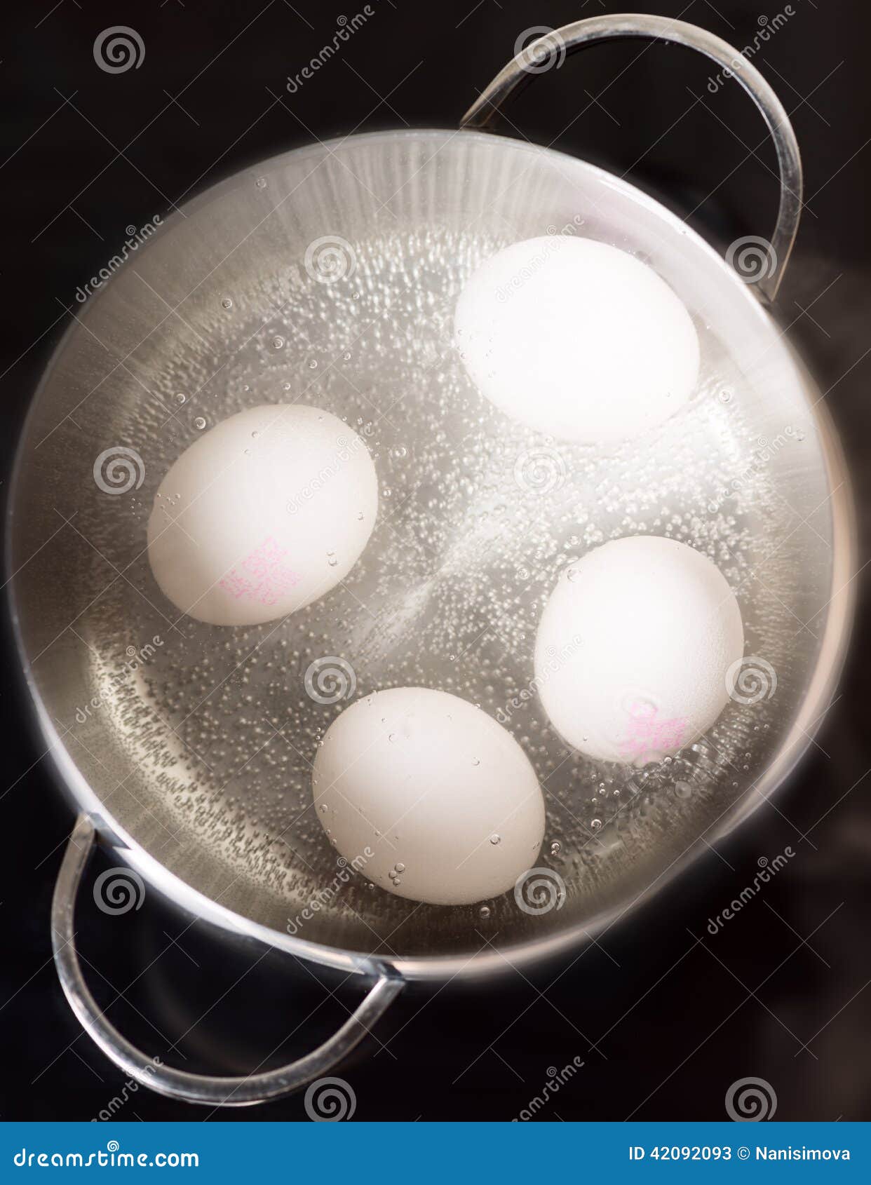 boiling eggs on cooktop top view