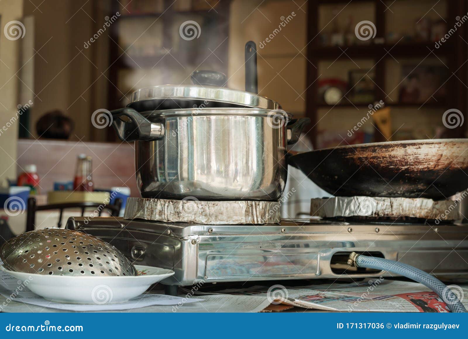 Boiling Water In Traditional Old Pot On Charcoal Stove Brazier Stock Photo,  Picture and Royalty Free Image. Image 38642693.