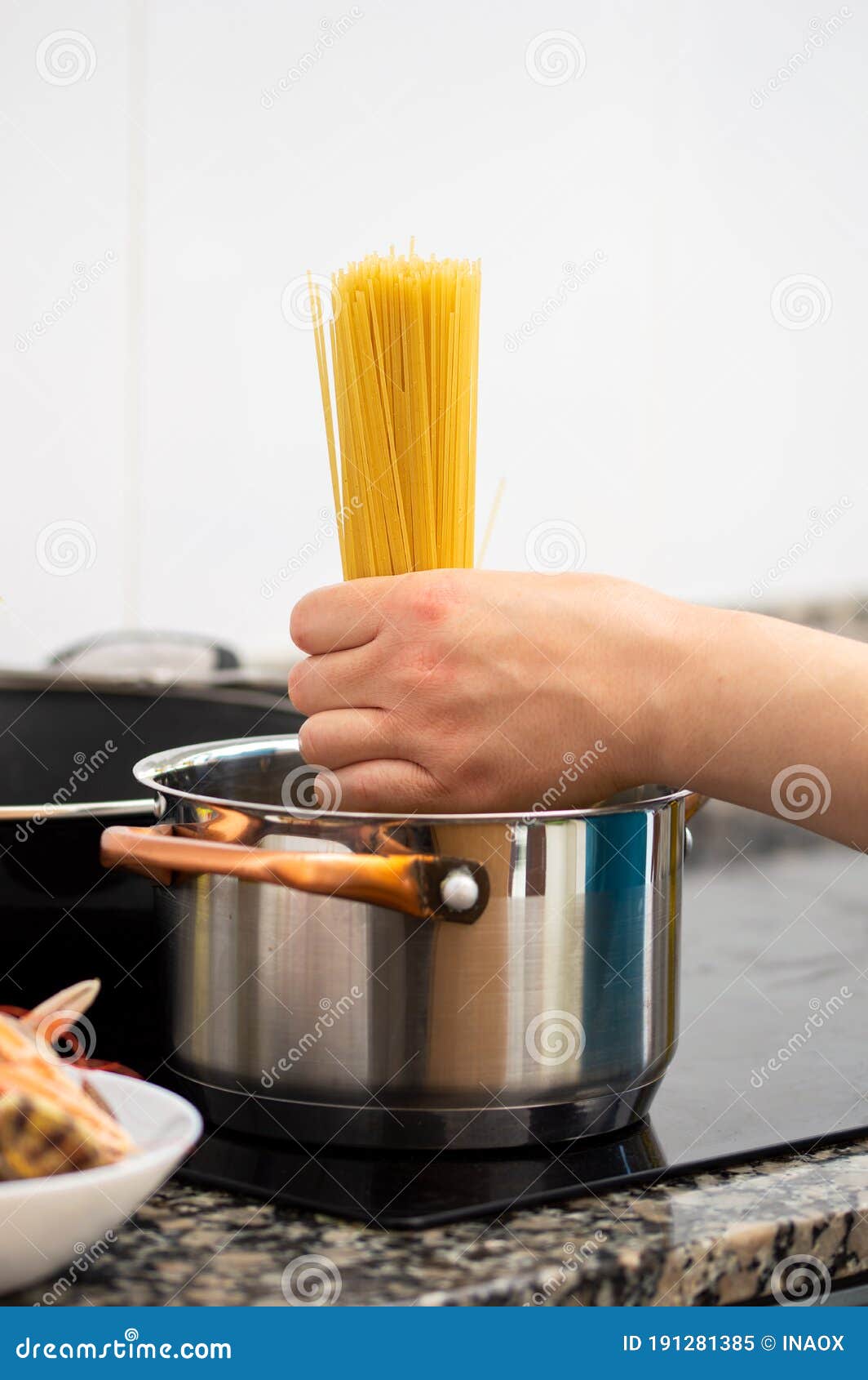 Putting the Spaghetti in the Cooking Pot Stock Image Image of cook