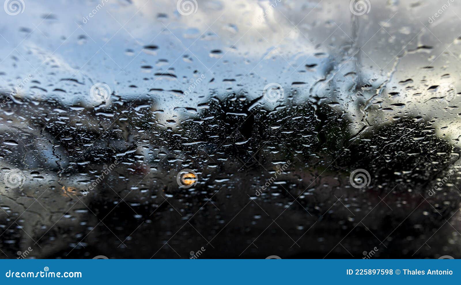 bokeh, rain, water drops. rainy day. car flashlights defocused