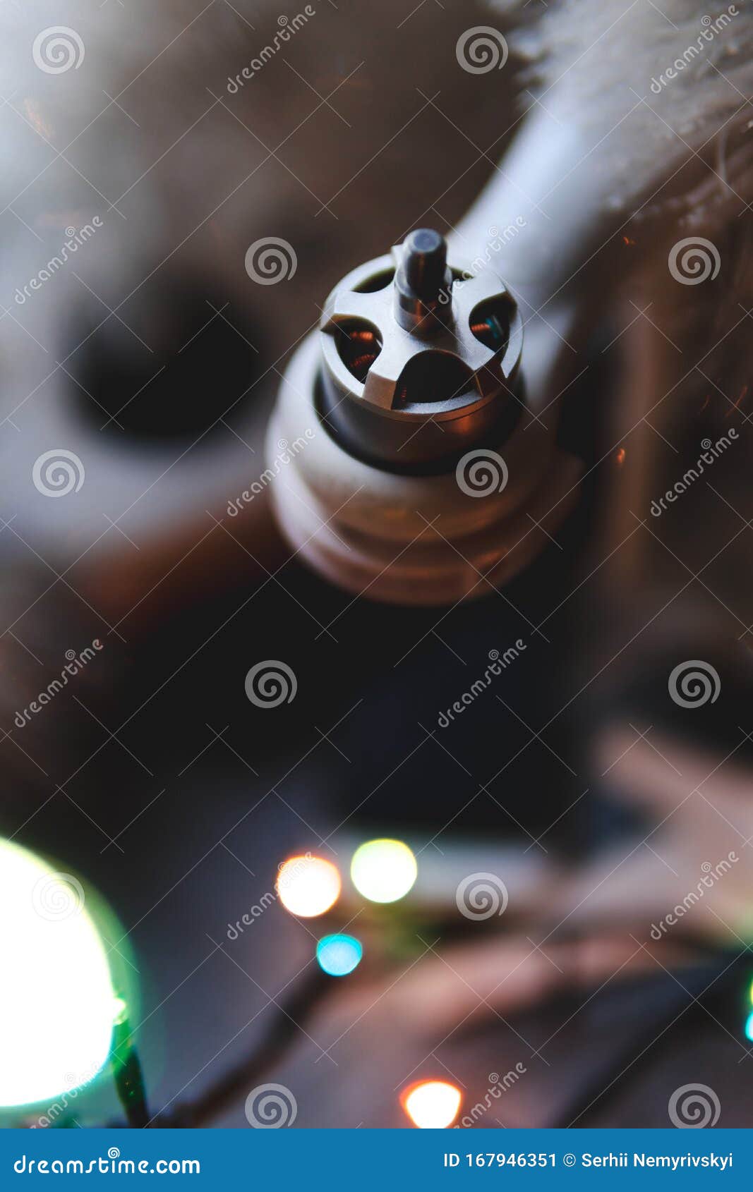 bokeh, selective focus, best christmas pressent, gift drone on a gray wooden table background. lights bokeh, top view, christmas
