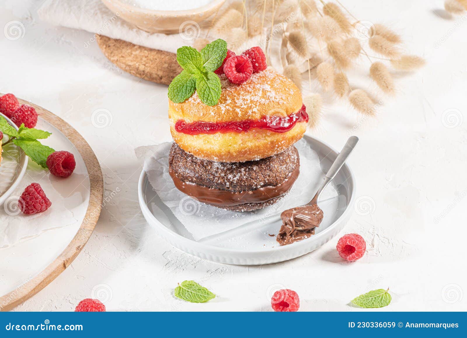 bolas de berlim, or `berlin balls`. portuguese fried dough with sugar, filled with chocolate or raspberry jam. portuguese fried